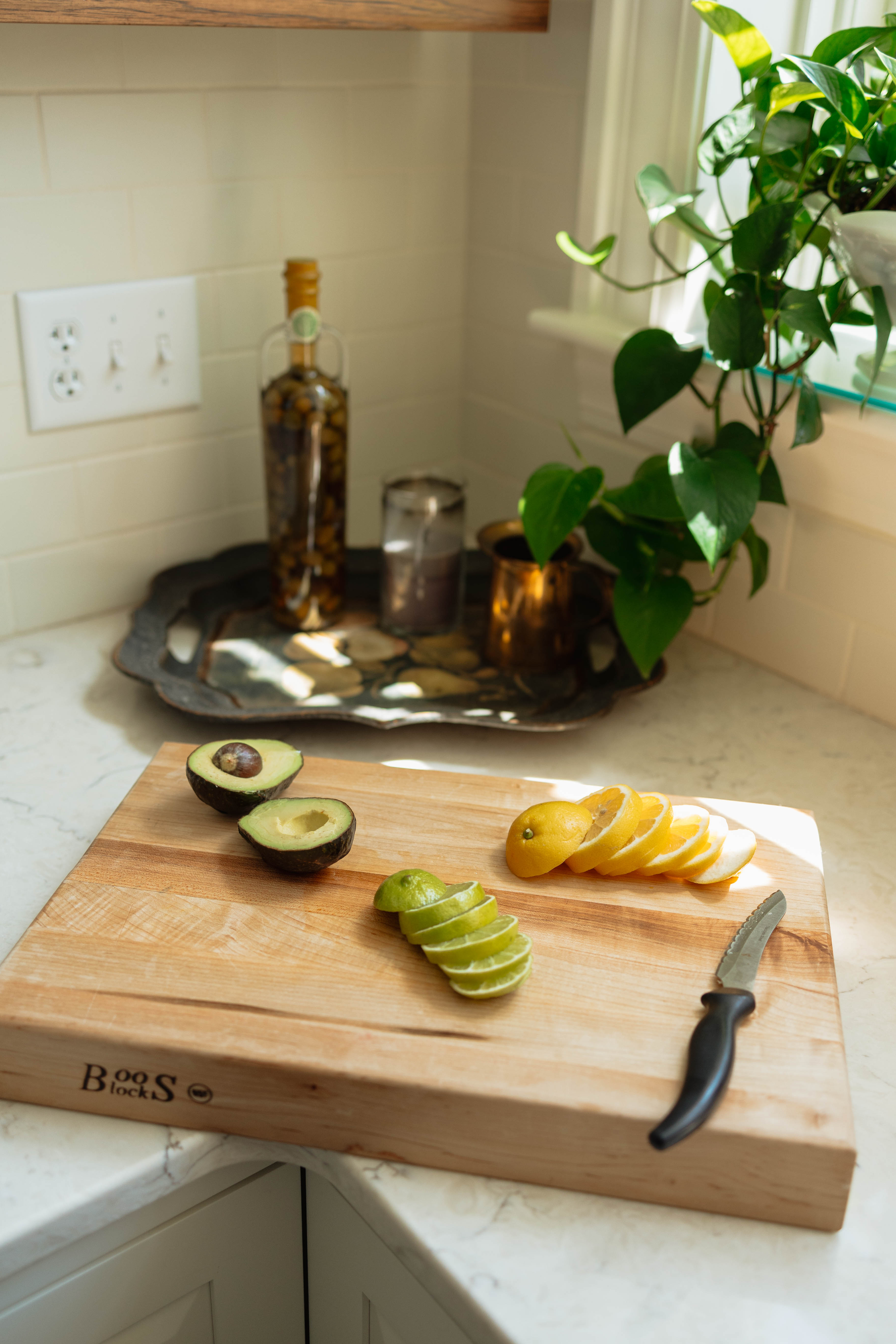 Fresh citrus and avocado in a sunlit kitchen